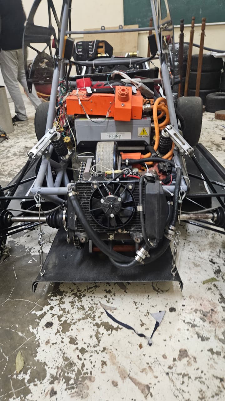 Rear view of the prototype electric race car showing its motor and radiator cooling circuit