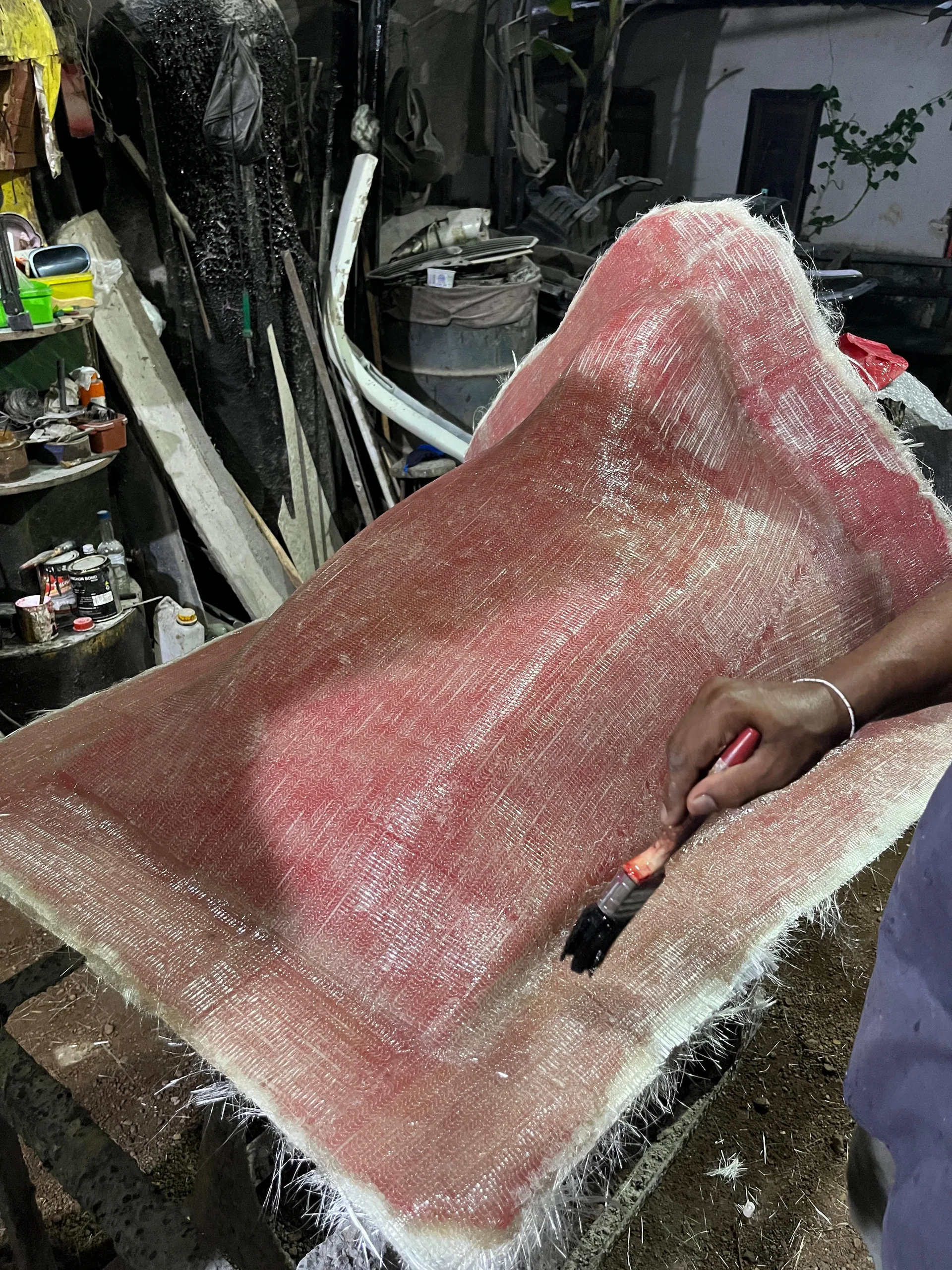 Hand wet-layup of a fiberglass mold