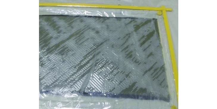 Hand-laid composite panel under vacuum bag